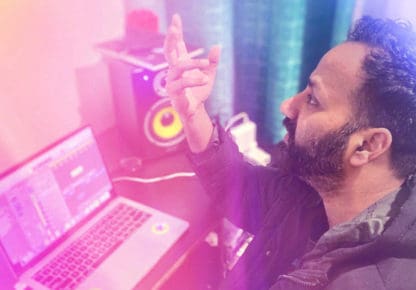 Arvinder Singh making music at a computer