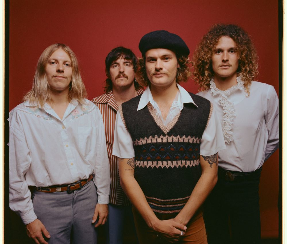 Image of 4 men standing looking at the camera.