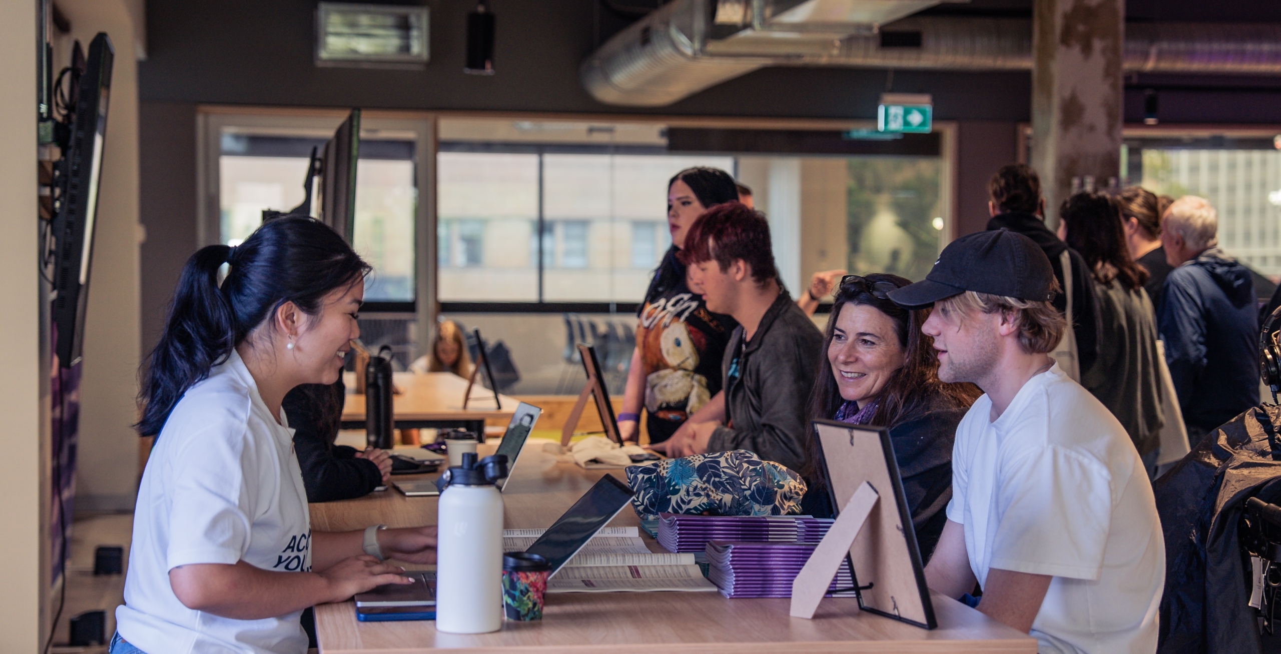 Parent and child talking to AIM staff